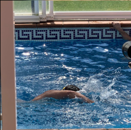 LONGEST CONTINUOUS SWIM BY A MAN IN A COUNTER CURRENT POOL