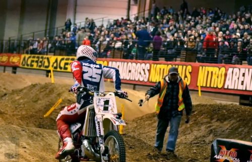Complete a full lap on an industry standard arenacross track while riding a dirt bike backwards.