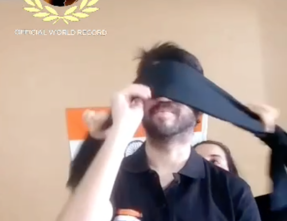 Most number of spins in a minute using 2 nunchuks simultaneously and being blind-folded (392)